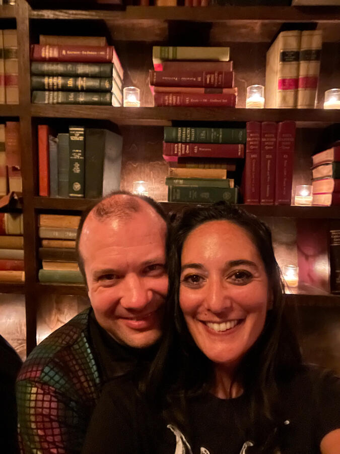 Untitled Michael and Michelle selfie with shelves of books in the background.